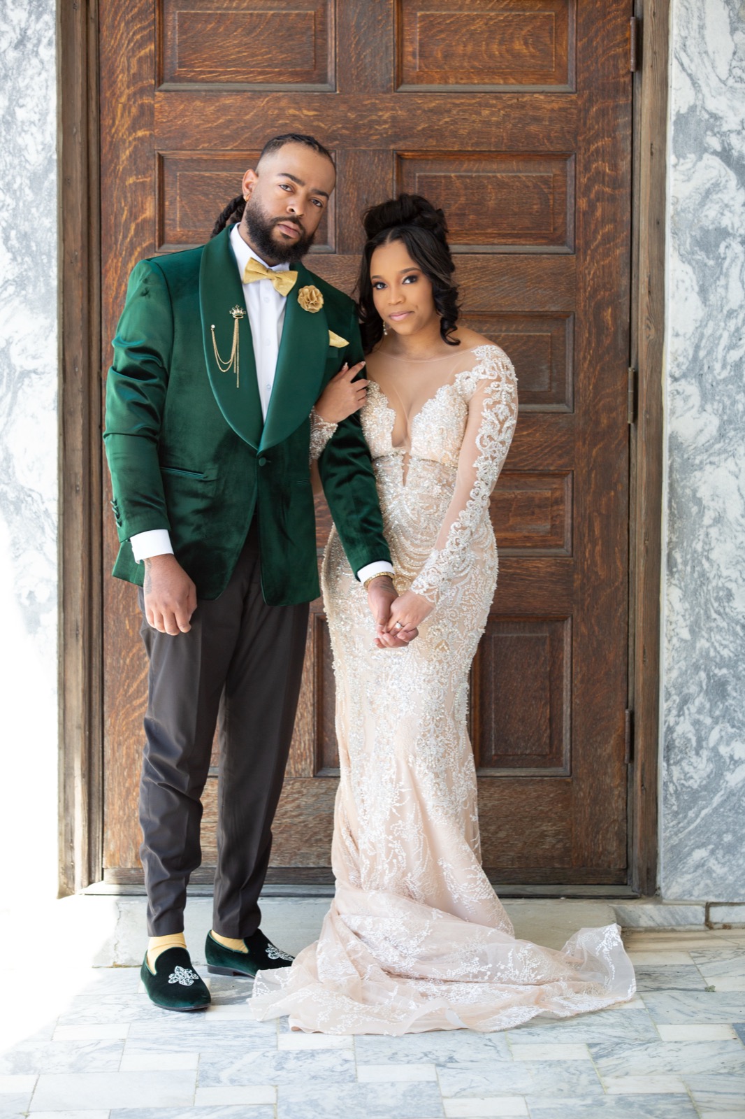 Elegant couple portrait at grand venue entrance — Atlanta wedding photography by Svpreme Studios