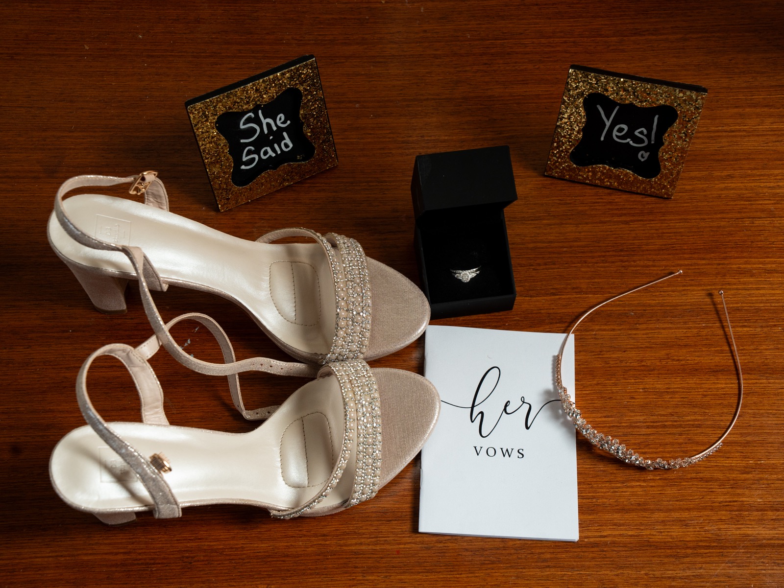 Wedding day flat lay with shoes, vows, and ring — Atlanta wedding detail photography